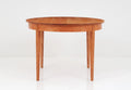 Table Ronde - Les courbes élégantes et les riches motifs de grain de la Table Ronde ajoutent une touche de formalité et de beauté à n'importe quel